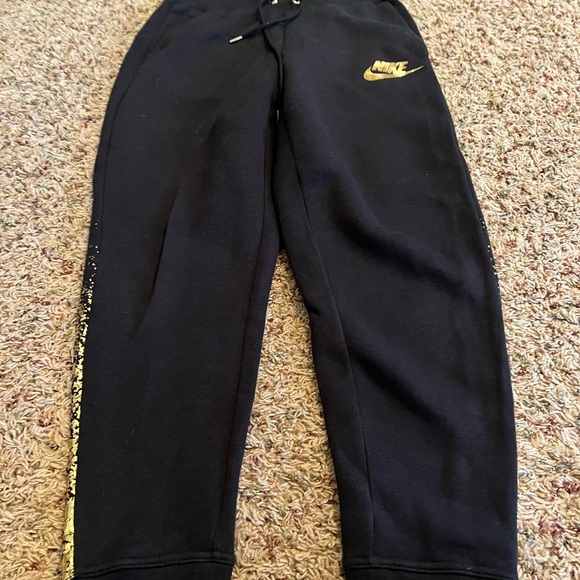 Nike Pants - Nike black and gold joggers size small